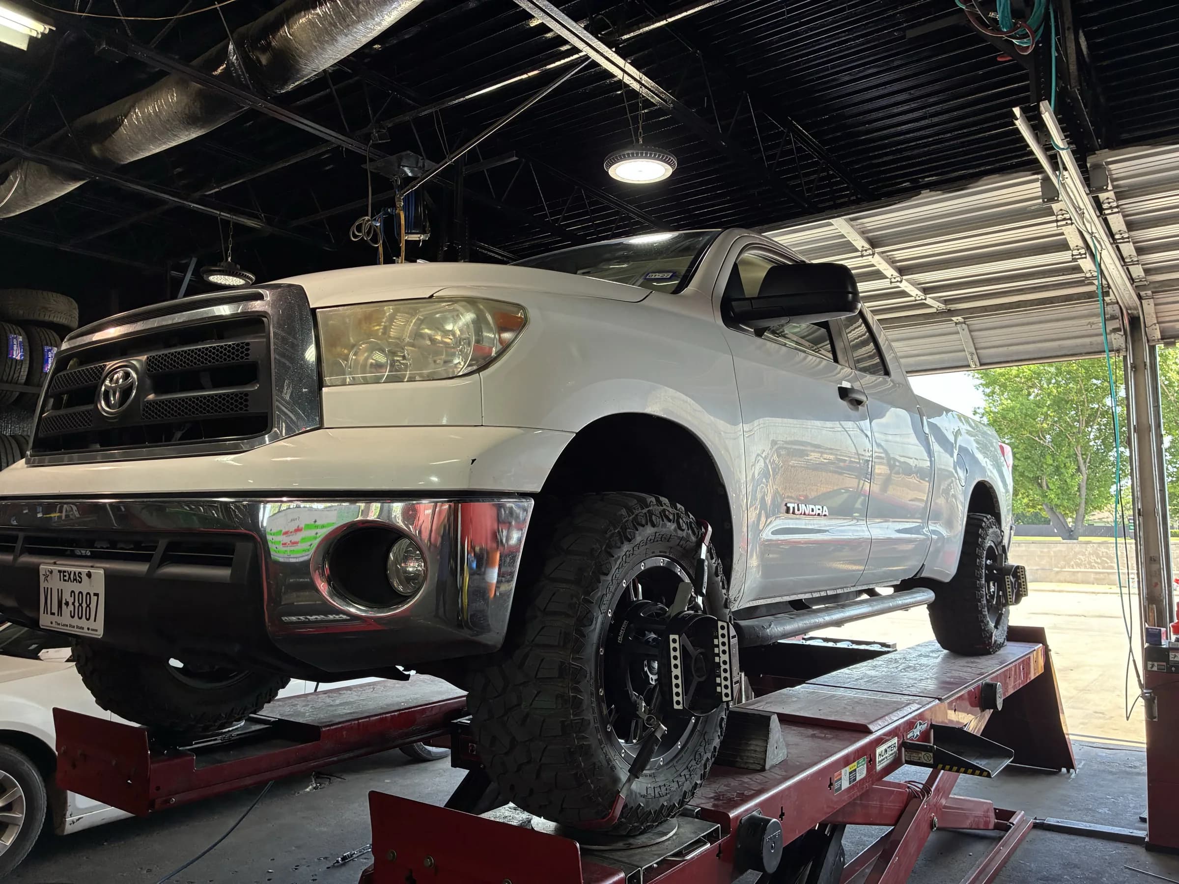Truck on the alignment rack at NexGen Auto in Irving, TX